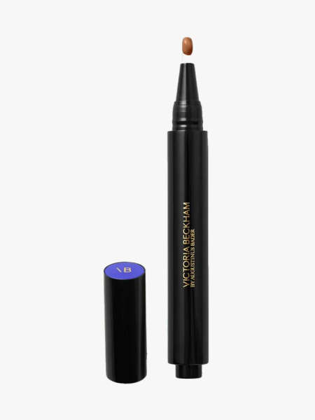 The Concealer Pen by Victoria Beckham X Augustinus Bader in branded component on a light gray background