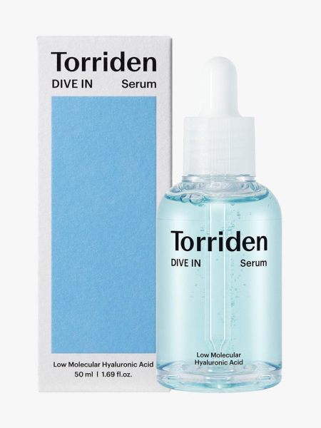 Anua Peach 70 Niacinamide Serum dropper bottle of light blue serum and box on light gray background